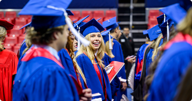 Students in caps and gowns at graduation